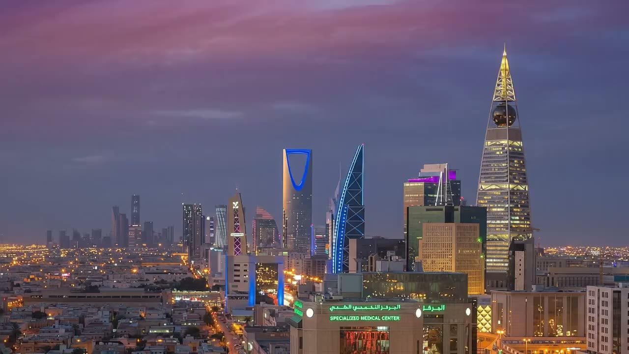 Riyadh skyline at dusk, Kingdom Centre and Al Faisaliah Tower lit under a violet sky